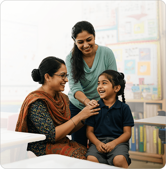 Teacher with parent and child in classroom